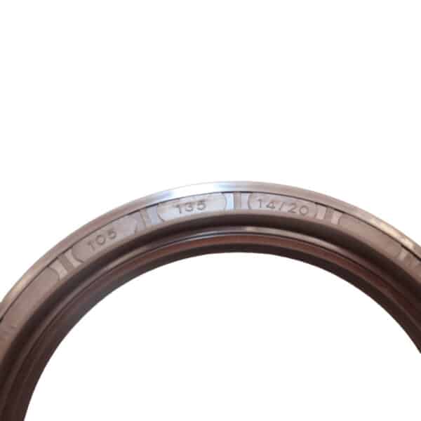 Dongfeng 153 middle axle oil seal 105x135x14x20 shown near a heavy-duty truck differential in a workshop environment