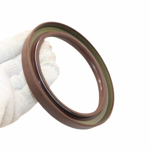 Dongfeng 153 middle axle oil seal 105x135x14x20 shown near a heavy-duty truck differential in a workshop environment