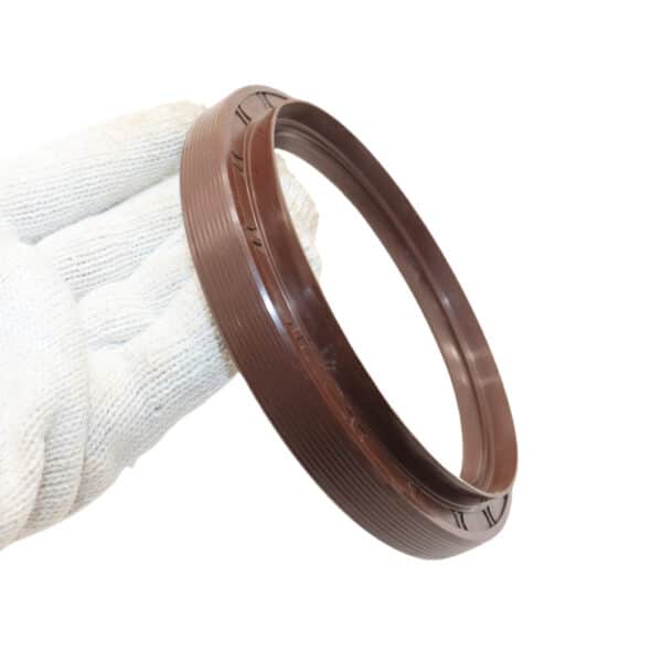 Dongfeng 153 middle axle oil seal 105x135x14x20 shown near a heavy-duty truck differential in a workshop environment
